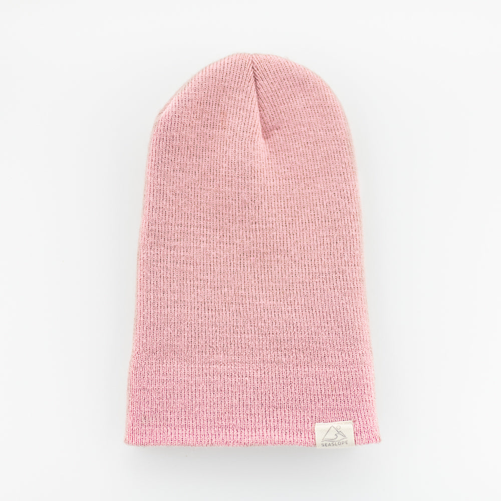 A PEONY INFANT/TODDLER BEANIE by seaslope1, crafted in the USA, is displayed flat on a white background. It includes a small label near the edge.