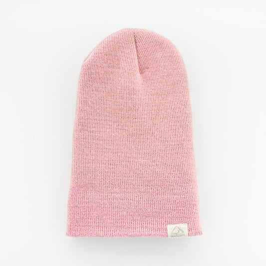 A PEONY INFANT/TODDLER BEANIE by seaslope1, crafted in the USA, is displayed flat on a white background. It includes a small label near the edge.